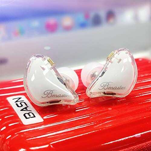 BASN Bmaster in-ear monitors on red case.