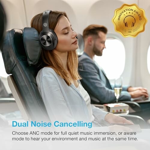 Woman wearing noise-cancelling headphones on airplane.