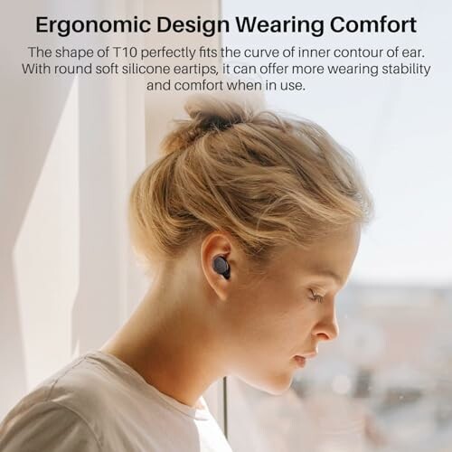 Person wearing earbuds with ergonomic design for comfort.