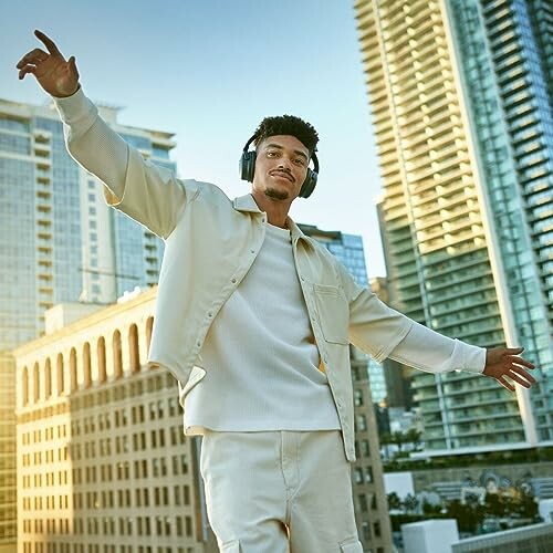 Man wearing headphones on a rooftop with city skyline