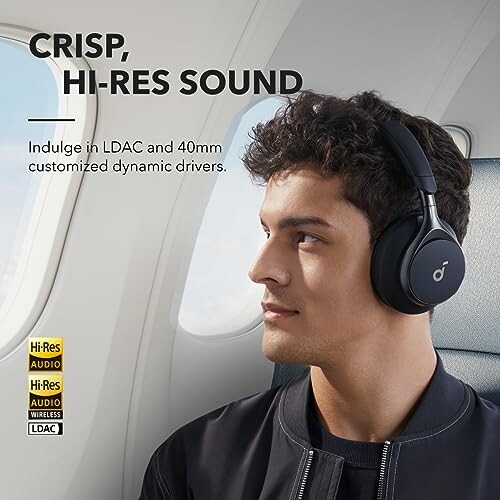 Man wearing headphones on a plane with text about hi-res sound.