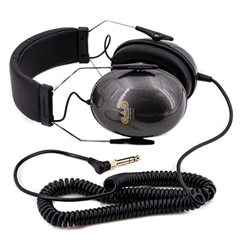 Professional studio headphones with coiled cable and large ear cups.