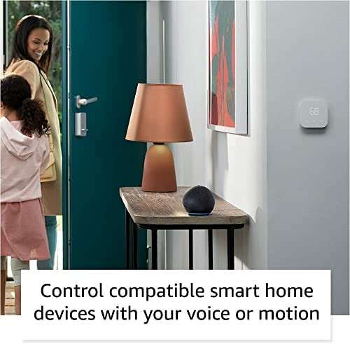 Woman entering home with smart devices on table.