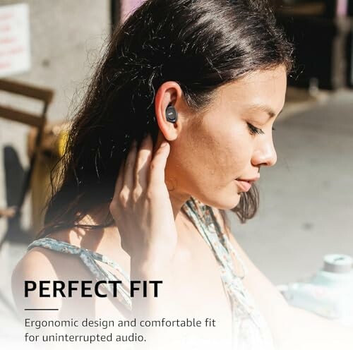 Woman wearing earbuds with text 'Perfect Fit'.